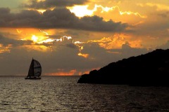 Guam sunset as yacht departs Apra Harbor at start of Rota Race.