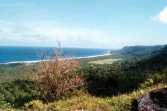 Scenic view of Tarague Beach on Anderson AFB, Guam from road cut through top of hills separating the beach from the main base.